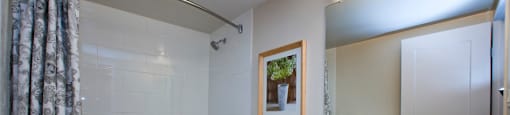 Cambridge Place Apartments bathroom featuring modern finishes and tub shower in Scarborough, ON