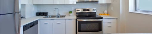 Cambridge Place Apartments kitchen featuring stainless steel appliances and contemporary cabinetry in Scarborough, ON