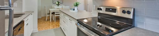 Cedarwoods Tower in Kitchener, ON kitchen includes stainless steel appliances