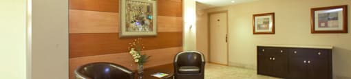 Cedarwoods Tower in Kitchener, ON lobby with chairs and table for seating