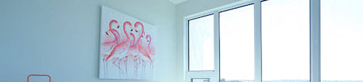 Cityview Apartments Bedroom with orange pillows and white sheets in Brampton, ON