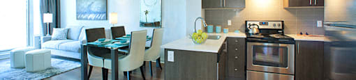 Cityview Apartments Neutral coloured kitchen and dining room with a teal table cloth in Brampton, ON