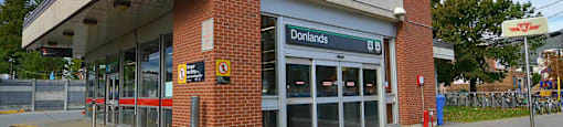 The front of a building with a sign that says Donlands.