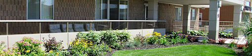 Building Exterior with green spaces at Bradford Place Apartments in Bradford, ON