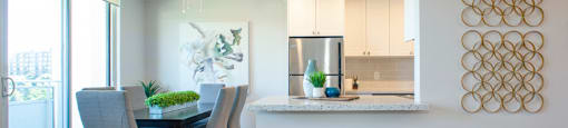 Harbourview Apartments dining area featuring view of kitchen peninsula in Oakville, ON