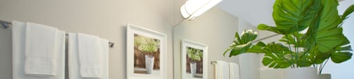 High Street Apartments bathroom featuring vanity storage with modern finishes in Fort Erie, ON