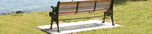 High Street Apartments neighbouring park bench in Fort Erie, ON