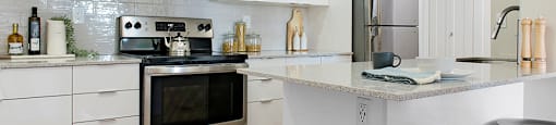 Horizon Towers in Burnaby, BC kitchen with upgraded cabinetry and breakfast bar