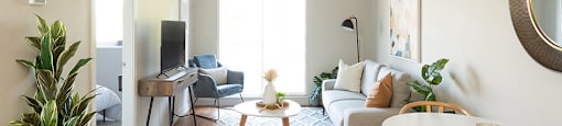 Horizon Towers in Burnaby, BC brightly lit living room with access to private balcony