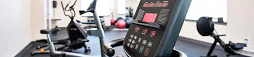 Hoylake Apartments in Victoria, BC gym with cardio and weight machines