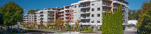 a view of an apartment building on a city street