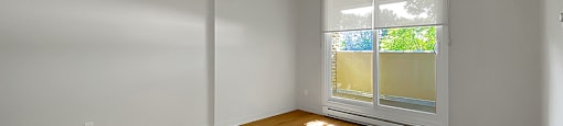 Kensington Apartments in Brockville living room with sliding glass doors going out to private balcony