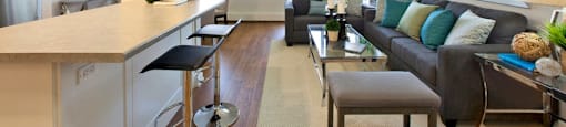 Laura Secord Apartments spacious living room with view into kitchen in Niagara Falls, ON