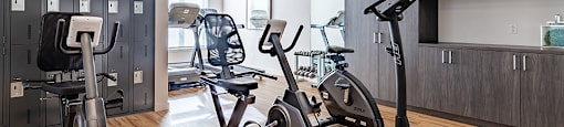 Fully equipped fitness centre and yoga studio at La Voile Pointe-Claire apartments in Pointe-Claire, Quebec
