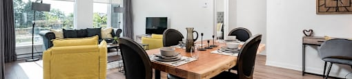 Open concept layout with view into dining and living rooms at Le Saint-Laurent Apartments in Brossard