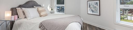 Second bedroom with two windows at Le Saint-Laurent Apartments in Brossard