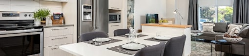 Open concept layout with view into kitchen and living room at Le Saint-Laurent Apartments in Brossard
