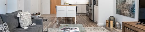 Open concept 2 bedroom apartment with view into kitchen at Le Saint-Laurent Apartments in Brossard