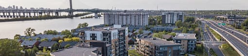 Arial view of Le Saint-Laurent Apartments complex and the St. Lawrence River