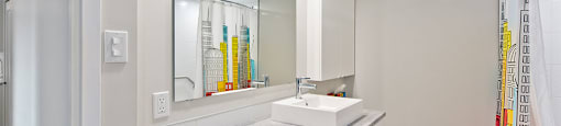 Les Jardins Hauterive in Sherbrooke, QC bathroom with full sized bathtub and large mirror