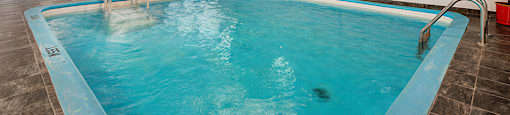 a swimming pool with a blue pool