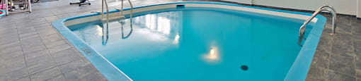 Les Jardins Hauterive in Sherbrooke, QC indoor pool and gym with equipment