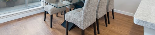 Dining room with a large 6-seater dining set in an open-concept dining room at Lorneville Apartments in Cornwall, ON