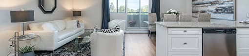 Lorneville Apartments open concept suite with view of living room and dining area from kitchen in Cornwall, ON
