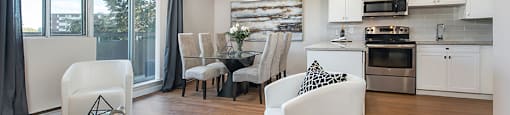 Lorneville Apartments open concept suite with view of kitchen and dining area from living room in Cornwall, ON