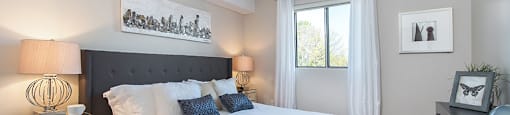 Primary bedroom, as seen from doorway and looking towards a window, in an open-concept 2 bedroom layout at Lorneville Apartments in Cornwall, ON