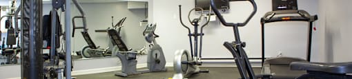 Fitness facility with cardio equipment and weight machine at Lorneville Apartments in Cornwall, ON