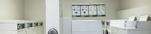 On-site laundry with washing machines and dryers and a smart card system at Lorneville Apartments in Cornwall, ON