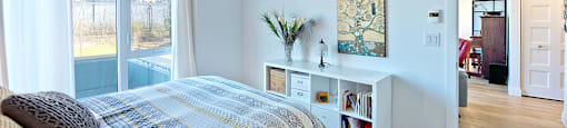 Lumineau in Sherbrooke, QC well lit bedroom and hard surface flooring throughout