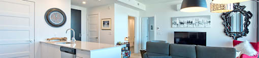 Lumineau in Sherbrooke, QC hard surfacing flooring throughout kitchen, dining and living room