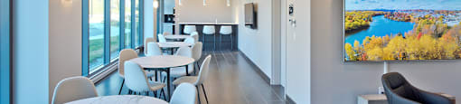 Lumineau in Sherbrooke, QC reception room with dining tables and seating