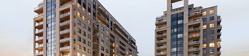 Two modern apartment buildings are shown in the image.