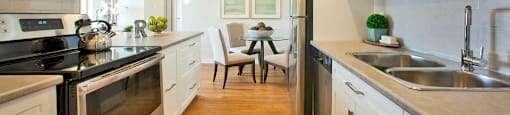 Millside Tower modern kitchen with stainless steel appliances in Milton, ON