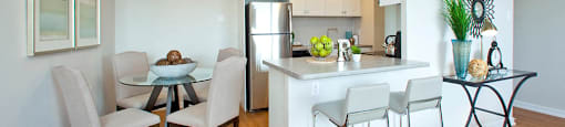 Millside Towers cozy dining area and kitchen with built-in breakfast bar in Milton, ON