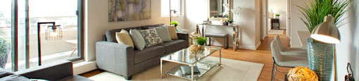 Millside Tower spacious living room with access to balcony in Milton, ON
