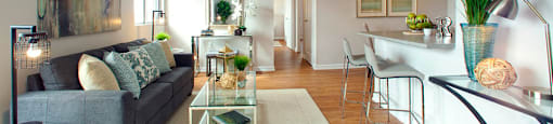 Millside Tower spacious living room with view of kitchen in Milton, ON