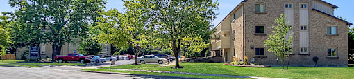 Moira Apartments grounds shown from across the street in Belleville, ON