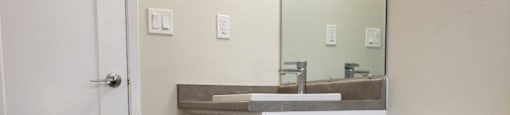 Refinished bathroom in an open-concept layout at Moira Apartments in Belleville, ON.