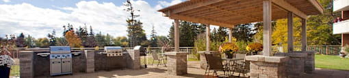 Northumberland Place patio with BBQs and gazebo with patio furniture in Port Hope, ON