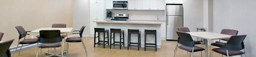 Northumberland Place social room with kitchen and tables and chairs in Port Hope, ON