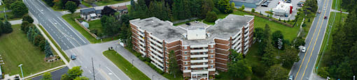 Northumberland Place image of drone exterior of building featuring the lake in Port Hope, ON