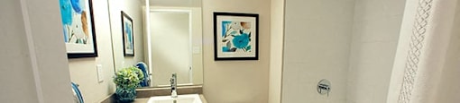 Edgehill Apartments in Barrie, ON Bathroom with a bathtub, toilet, and sink