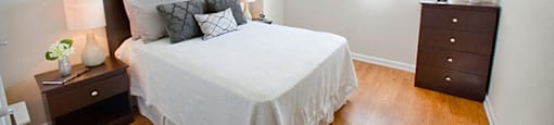 Edgehill Apartments in Barrie, ON Bedroom with a neatly made bed