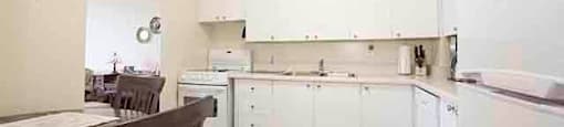 Prince William Apartments kitchen with dining area in Bellville, ON