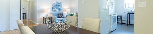 Cedarwoods Towers dining room with view into kitchen and living room in Kitchener, ON