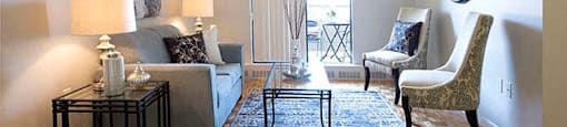Cedarwoods Tower living room with access to balcony in Kitchener, ON